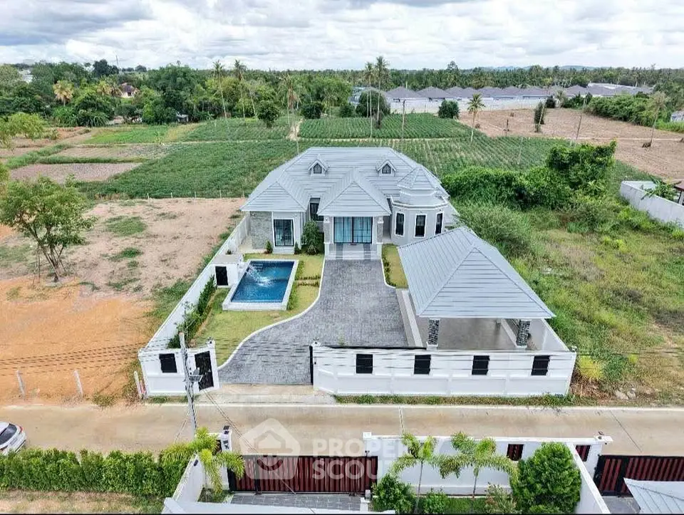 Luxurious villa with private pool and spacious garden in serene countryside setting.