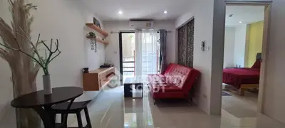 Modern living room with red sofa and balcony access in stylish apartment