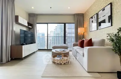 Modern living room with city view, stylish decor, and natural light.