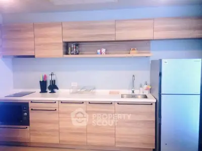 Modern kitchen with wooden cabinets and stainless steel appliances