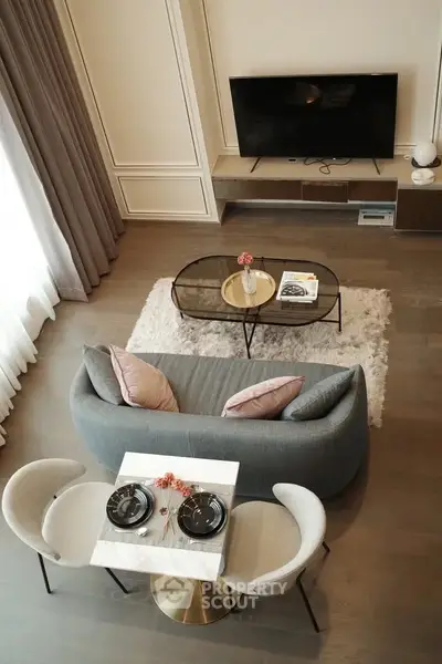 Elegant living room with modern decor, cozy seating, and stylish dining area.