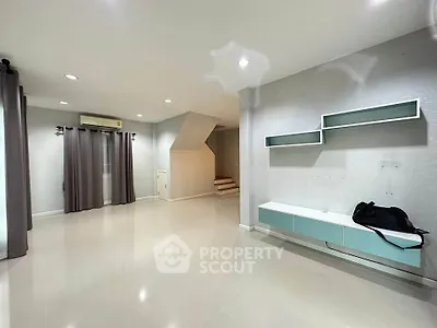 Spacious modern living room with sleek design and built-in storage