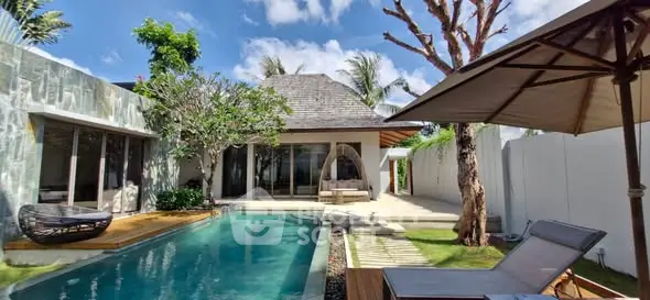 Luxurious villa with private pool and lush garden, perfect for tropical living.