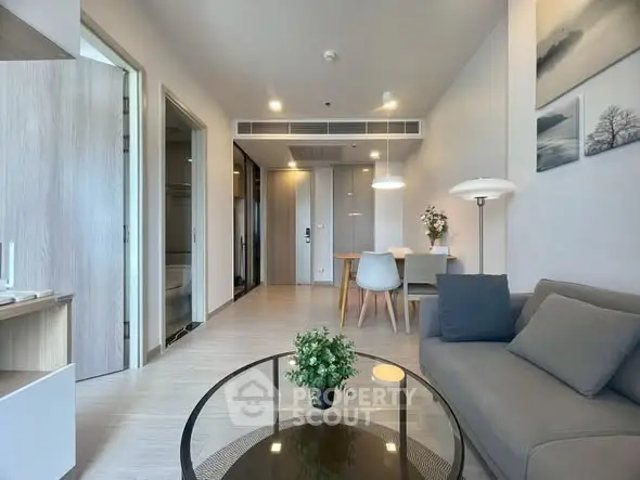 Modern living room with sleek furniture and stylish decor in a contemporary apartment.