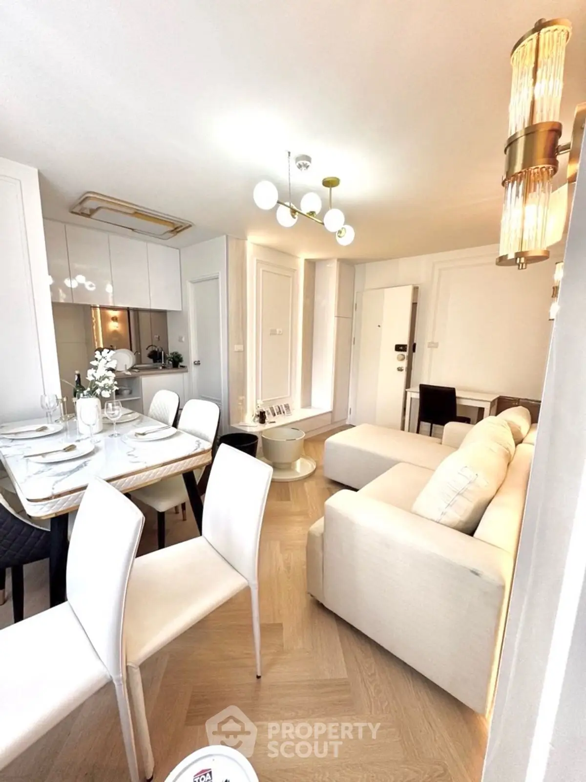 Modern living room with elegant dining area and stylish lighting