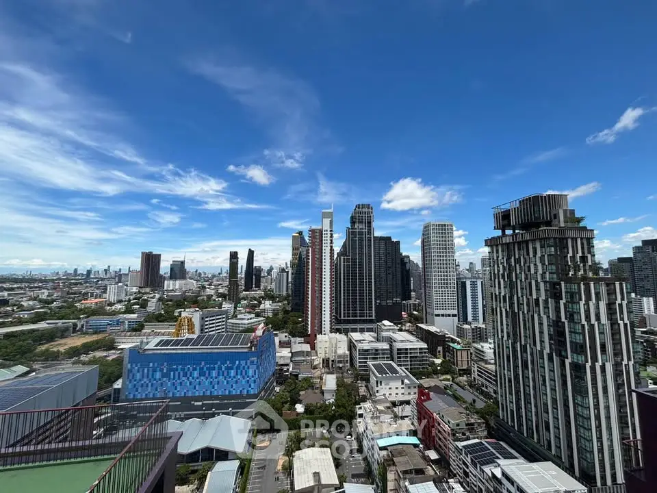 Stunning cityscape view from a high-rise building showcasing modern architecture and vibrant skyline.