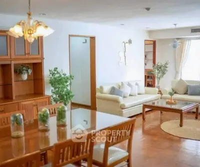 Spacious living room with elegant wooden furniture and cozy seating area