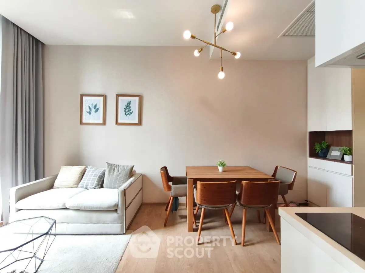 Modern living room with stylish dining area and contemporary lighting