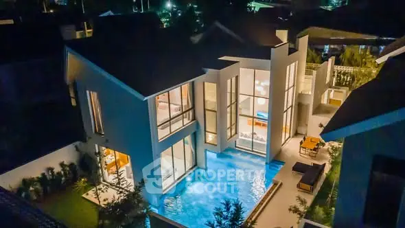 Luxurious modern villa with private pool and stunning night lighting