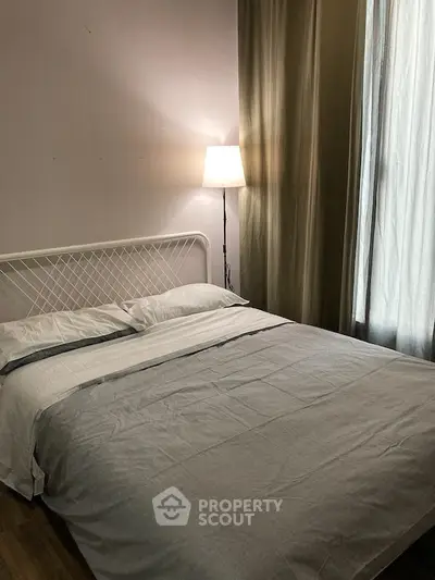 Cozy bedroom with elegant lighting and modern decor