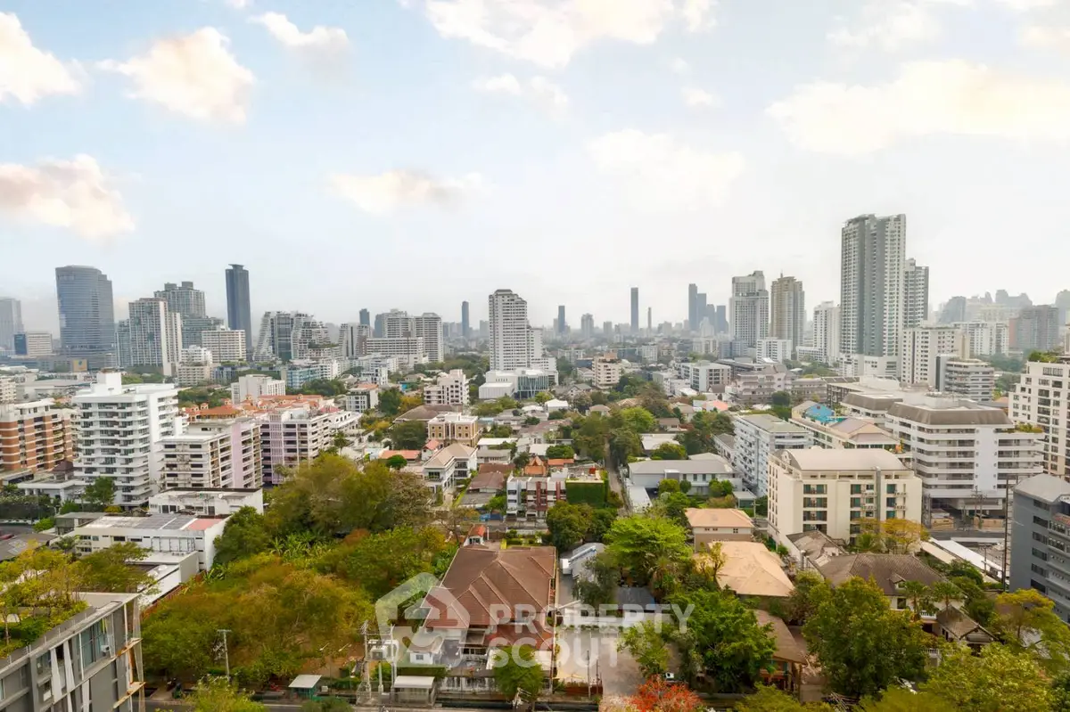 Stunning cityscape view showcasing urban skyline and lush greenery, perfect for real estate investment.