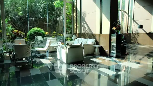 Luxurious modern living room with large windows and garden view