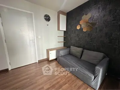 Modern living room with stylish decor and comfortable sofa, perfect for relaxation.