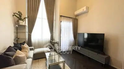 Modern living room with high ceilings and sleek decor