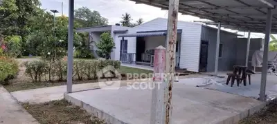 Charming modern house with lush garden and spacious patio area.