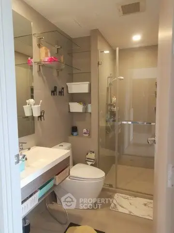 Modern bathroom with glass shower and sleek fixtures