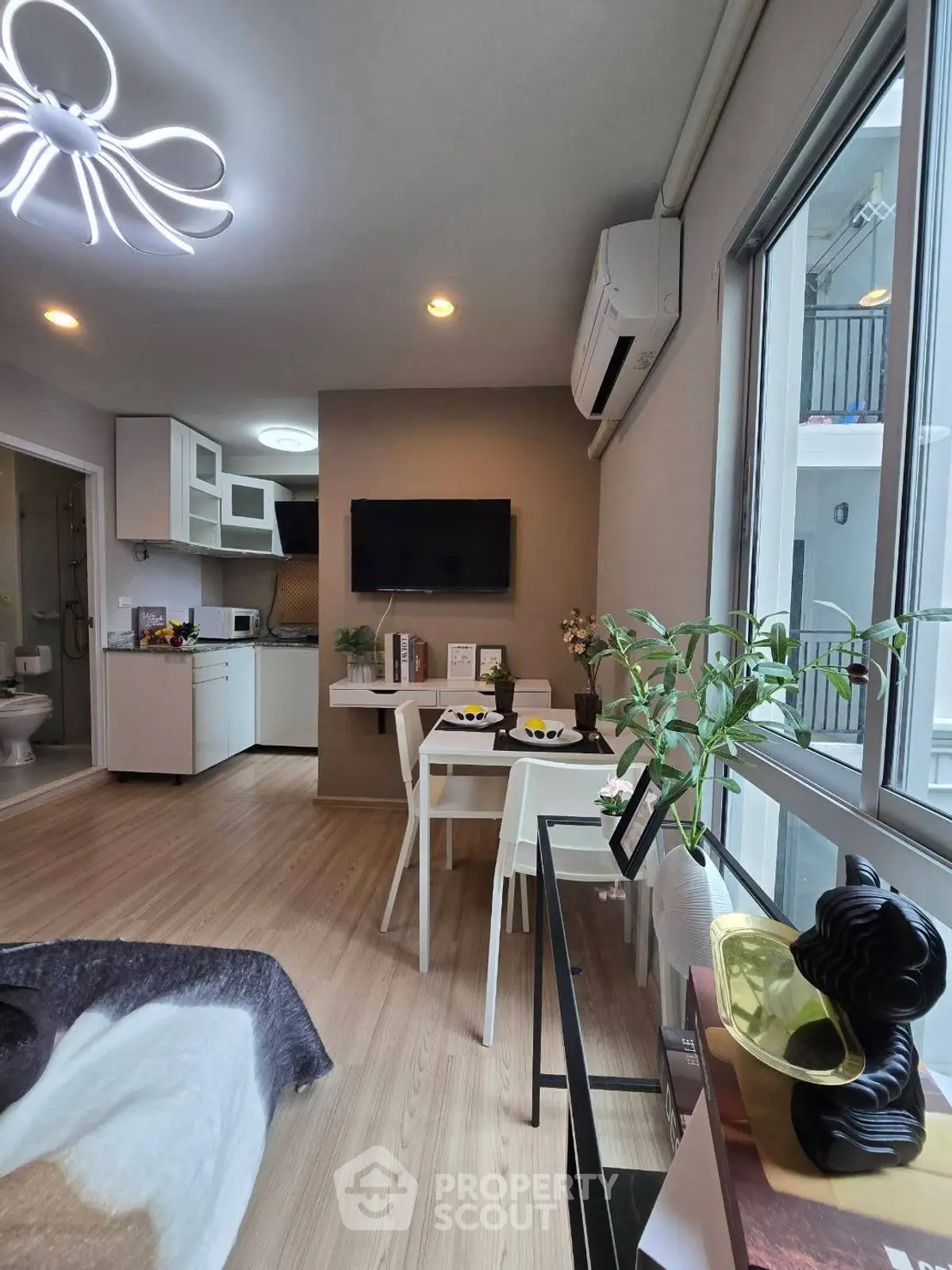 Modern living room with open kitchen and stylish decor