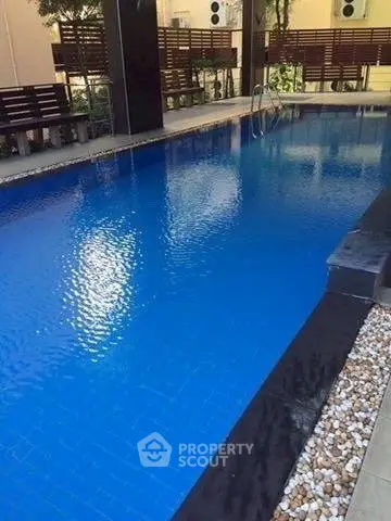Luxurious residential pool area with modern design and serene ambiance.