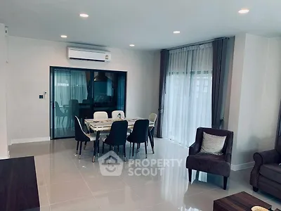 Modern living room with dining area and elegant furnishings