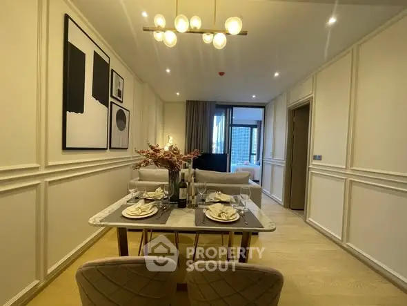 Elegant dining area with modern decor and cozy lighting in a stylish apartment.