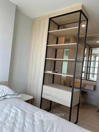 Modern bedroom with stylish shelving and cozy ambiance