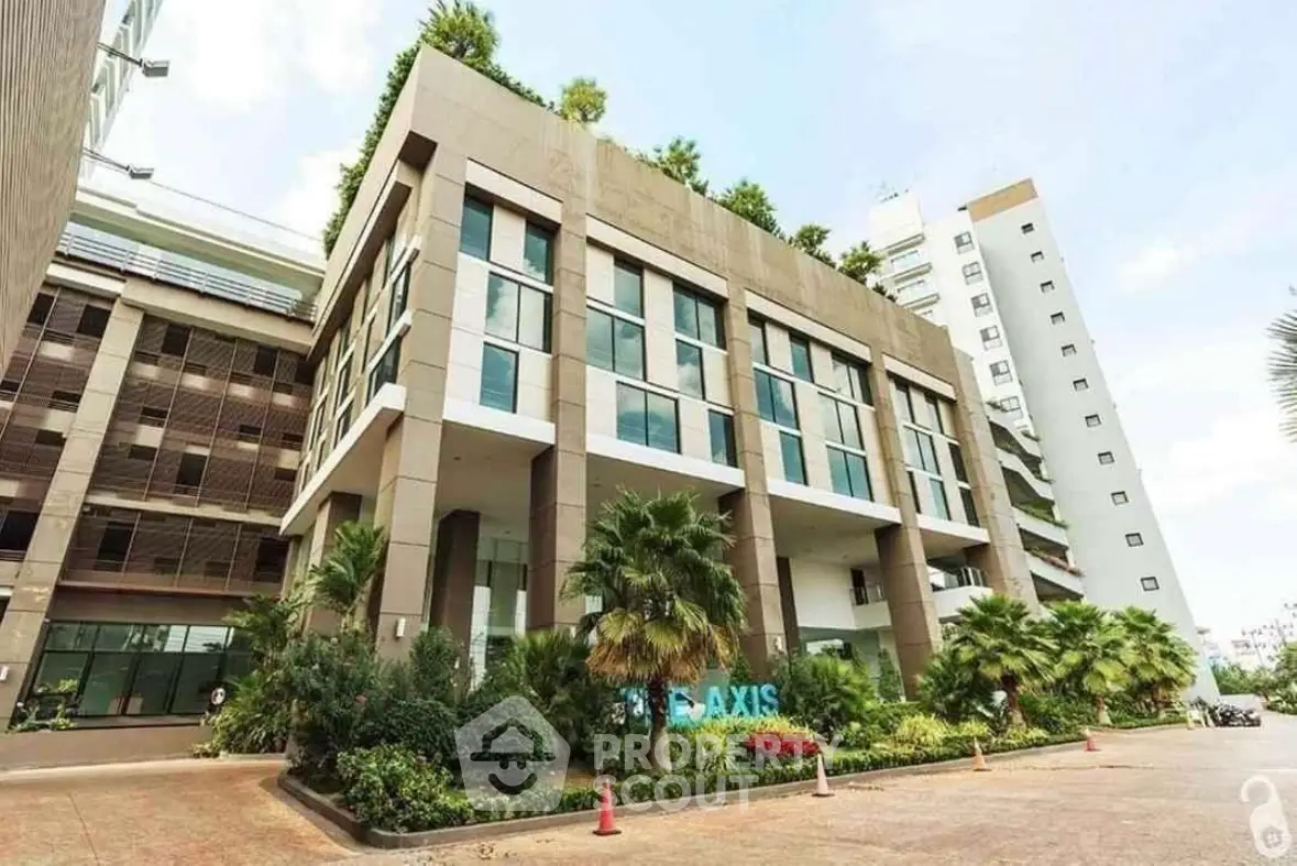 Modern commercial building with lush landscaping and contemporary design