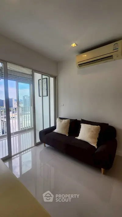 Modern living room with city view and cozy sofa in high-rise apartment