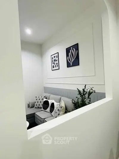 Stylish modern living room with elegant decor and cozy seating area.