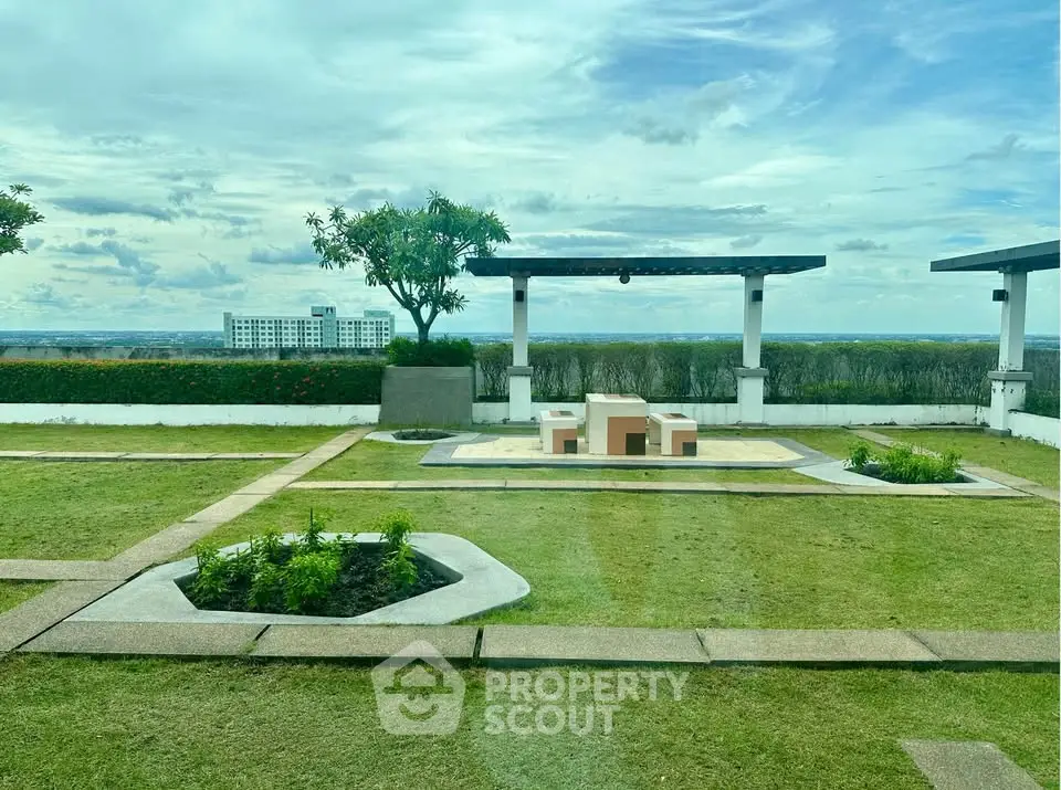 Stunning rooftop garden with panoramic city views and modern seating area.