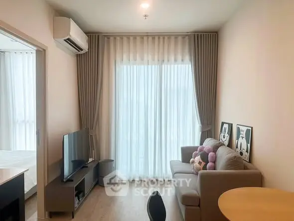 Modern living room with cozy sofa, TV, and large window with curtains in a stylish apartment.