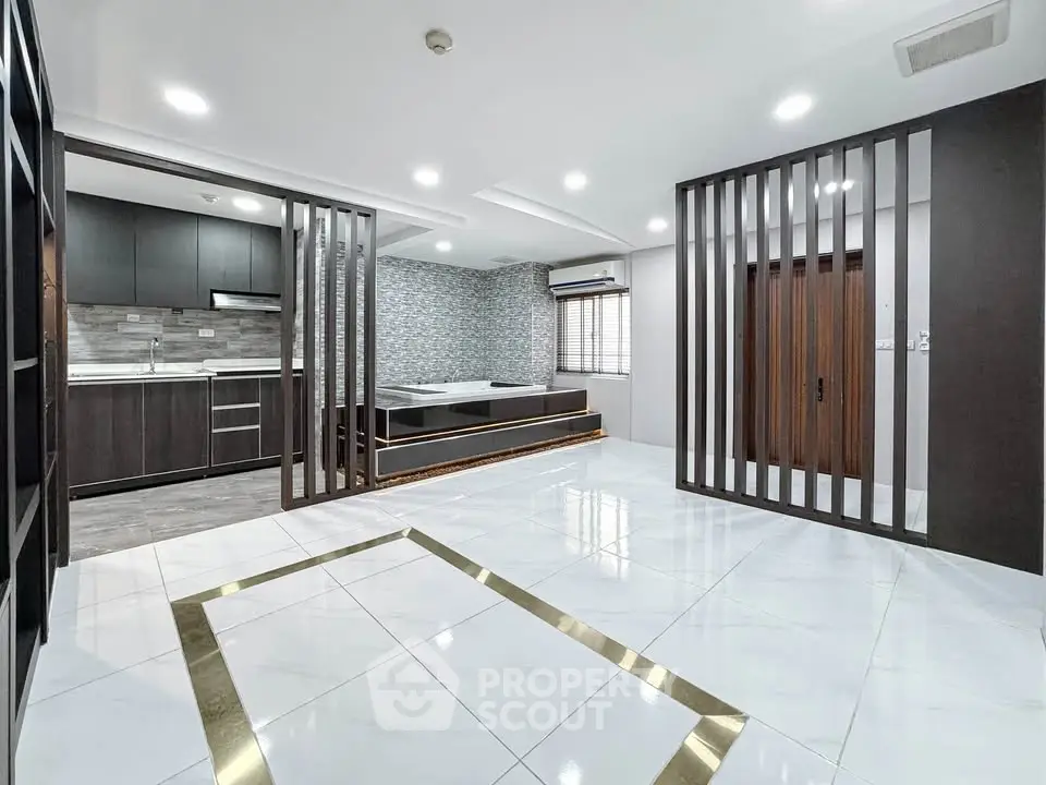 Modern open layout living space with sleek kitchen and stylish design
