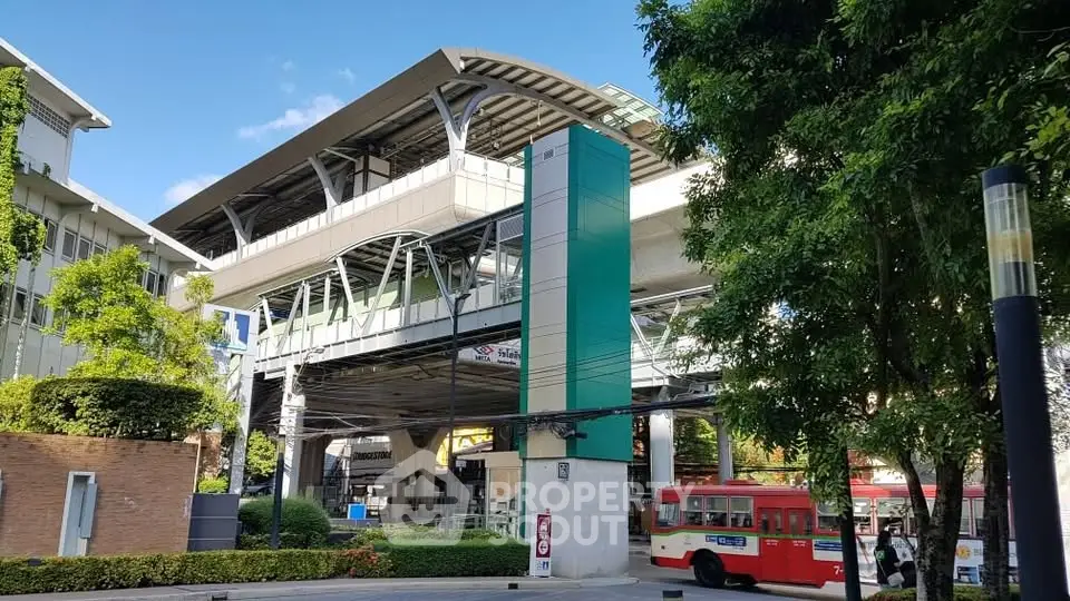 Modern urban transit station with sleek architecture and vibrant surroundings.