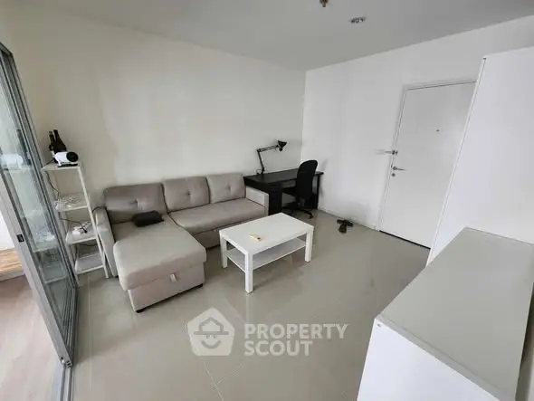 Modern living room with cozy sofa and sleek desk setup