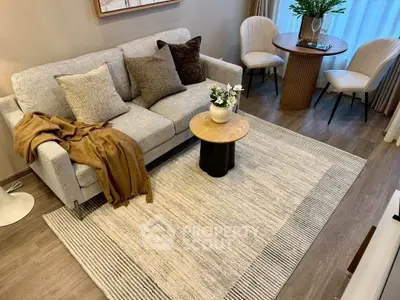 Stylish living room with cozy sofa, elegant decor, and natural light for a welcoming ambiance.