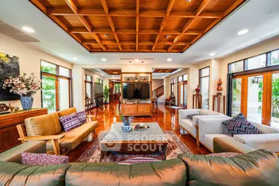 Luxurious spacious living room with elegant wooden ceiling and stylish decor
