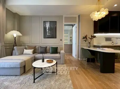 Modern living room with elegant decor and open kitchen layout