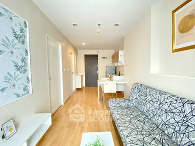 Modern living room with stylish decor and open kitchen layout, perfect for urban living.