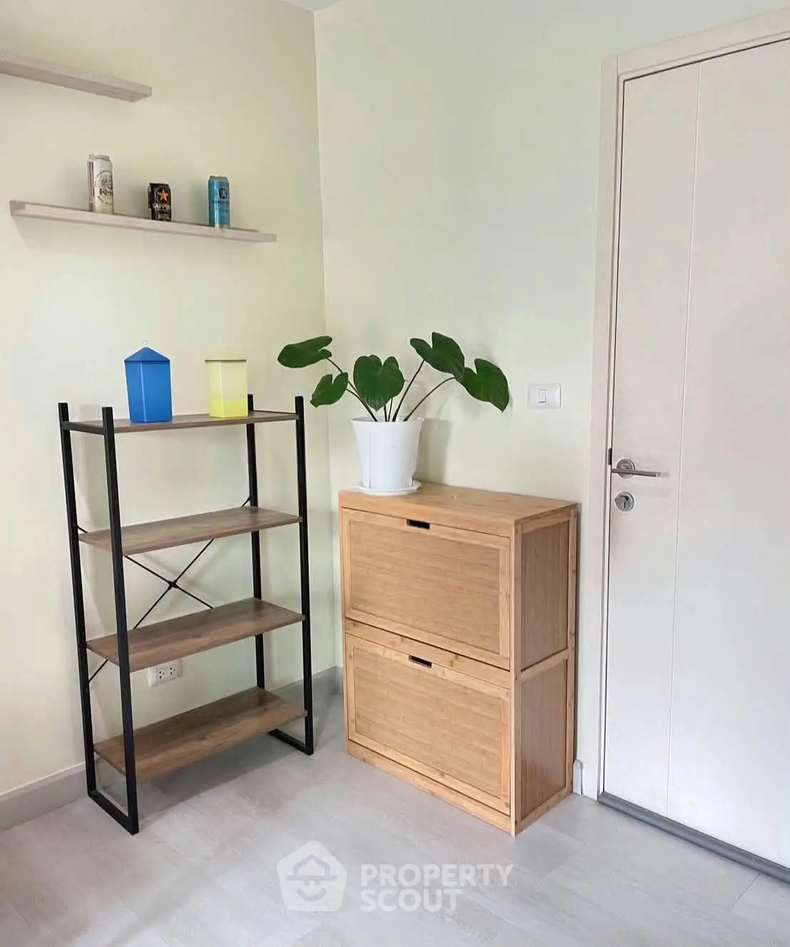 Stylish interior corner with modern shelving and storage unit, perfect for home organization.