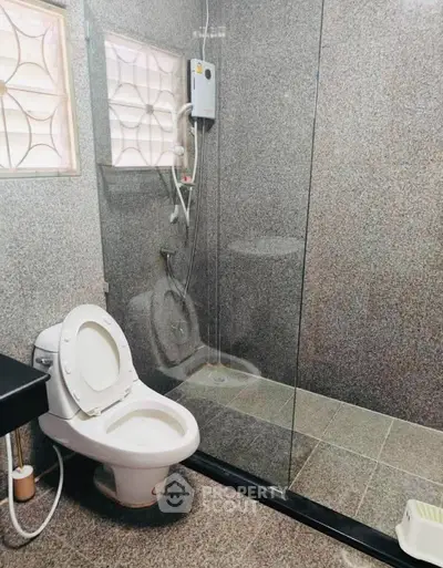 Modern bathroom with glass shower enclosure and sleek design
