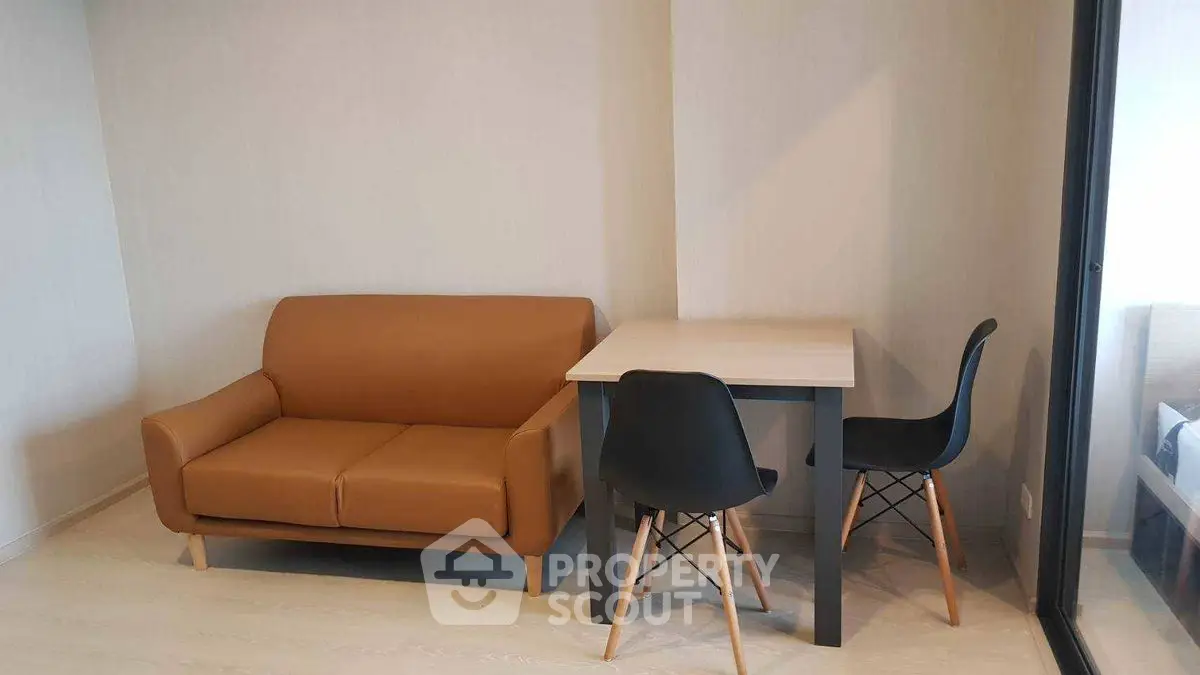 Modern minimalist living room with brown sofa and dining table set