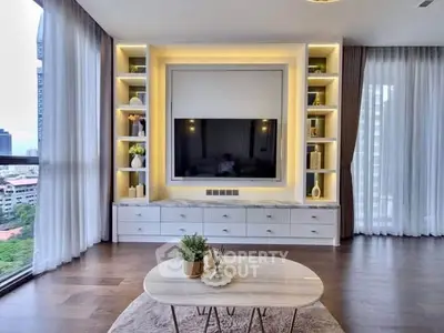 Luxurious living room with modern built-in entertainment center and panoramic city views.