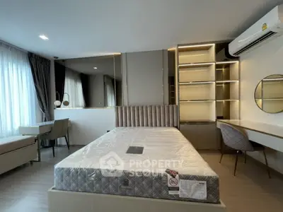 Modern bedroom with stylish furniture and large windows for natural light
