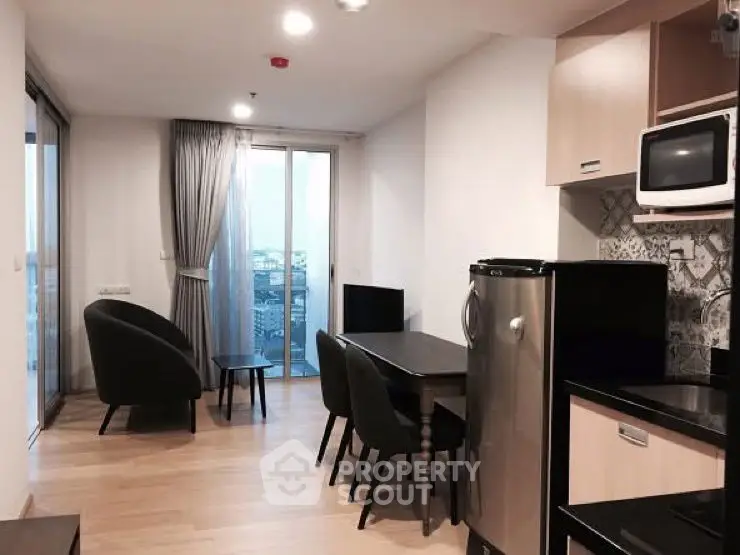 Modern apartment living room with dining area and city view balcony.