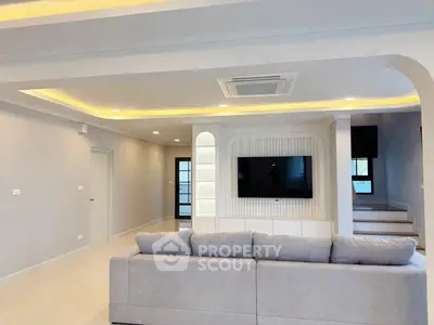 Spacious modern living room with elegant lighting and stylish decor