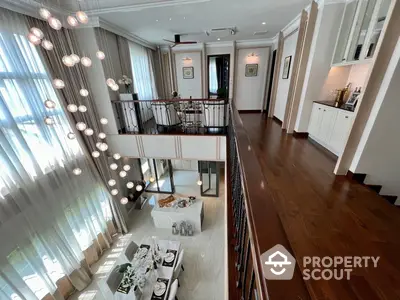 Luxurious multi-level living space with elegant hardwood floors, modern lighting, and a sophisticated open-plan design, perfect for entertaining and comfortable living.