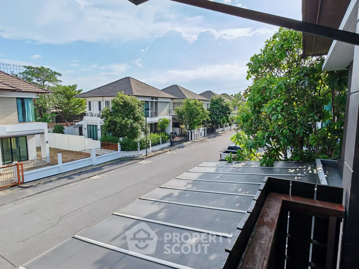 Charming suburban street view with modern houses and lush greenery, perfect for tranquil living.