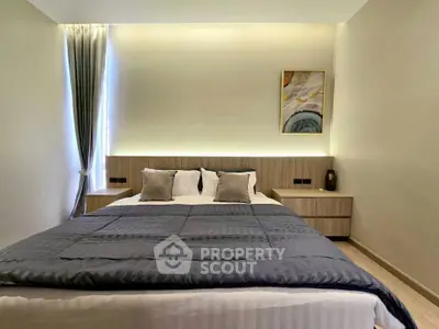 Modern bedroom with stylish decor and ambient lighting