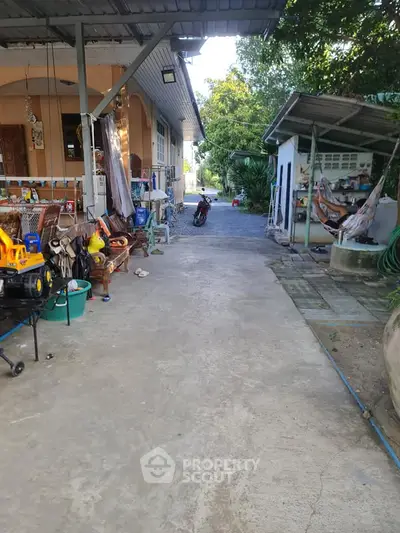 Charming rural property with spacious outdoor area and covered patio, perfect for relaxation and family activities.