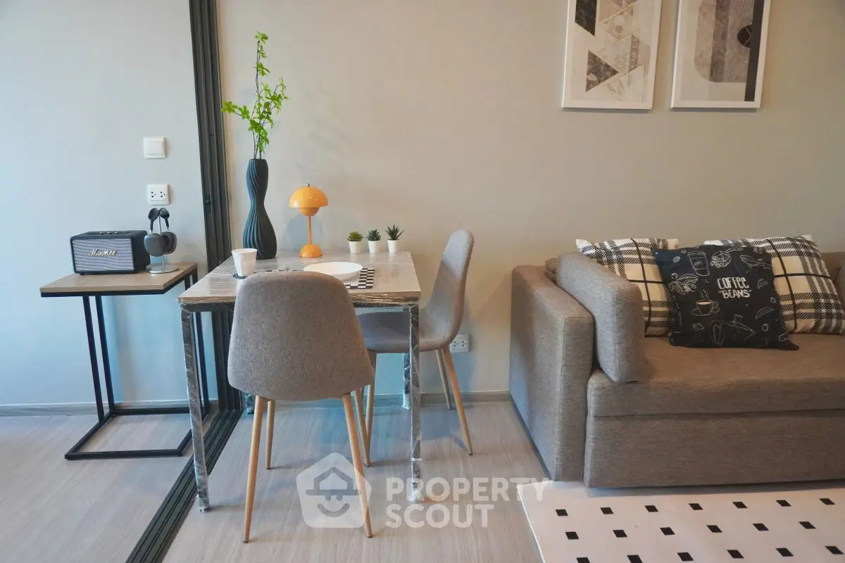 Modern living room with stylish decor and cozy seating area.