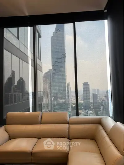 Luxurious living room with stunning city view from high-rise apartment